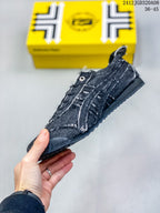 Side view highlighting the low-top silhouette, stitched panels, lace fastening, and textured outsole.