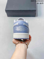 Rear view showing the blue-gray heel panel and embossed Jordan branding.