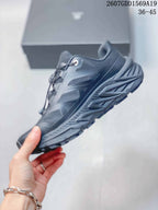 Side view of the dark gray KAILAS outdoor shoe showing mesh panels, protective overlays, midsole shaping, and lugged outsole.