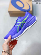 Side profile of the purple running sneaker with lime ASICS stripes and a cushioned midsole.
