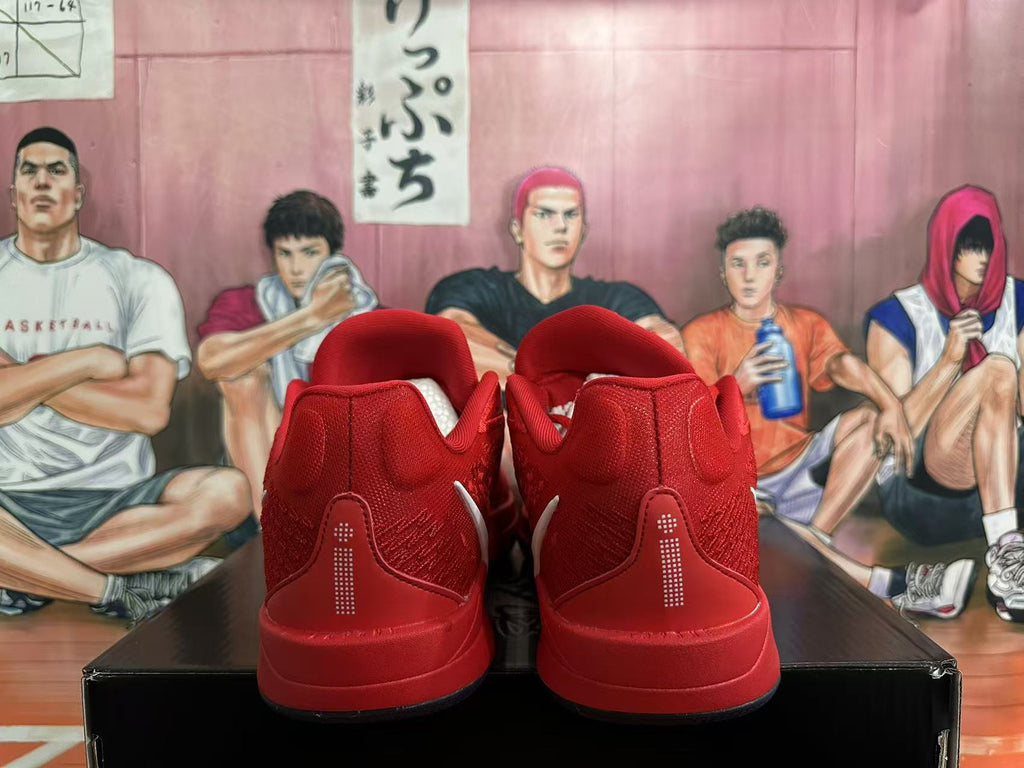 Rear view of red Nike basketball shoes with dotted heel details.