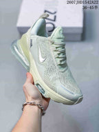 Angled side view showing the perforated upper, Swoosh logo, and large transparent heel unit.