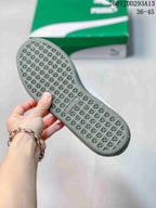 Close view of the gray geometric tread pattern on the outsole of a PUMA sneaker.