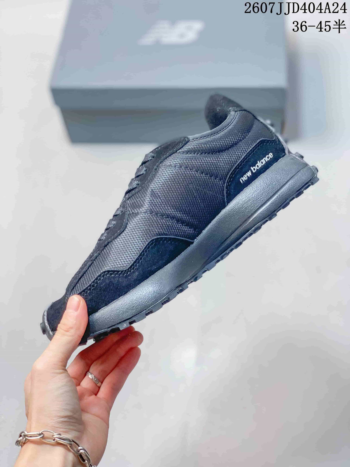 Side profile showing black textile panels, overlay panels, and heel branding