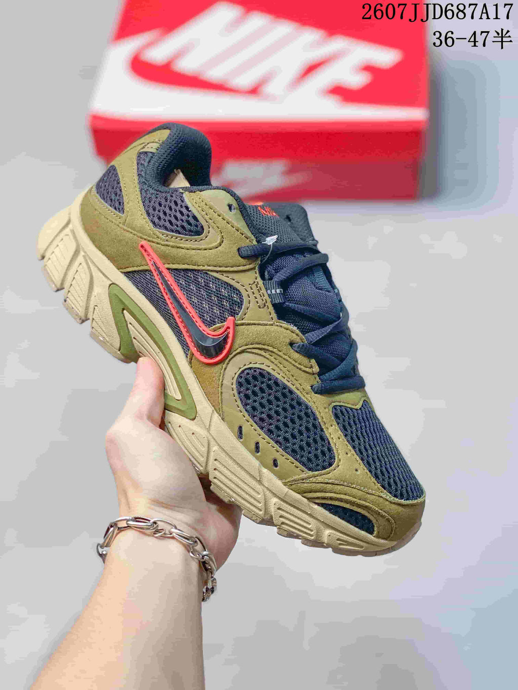 Olive and navy Nike V5 RNR sneaker with red accent details.