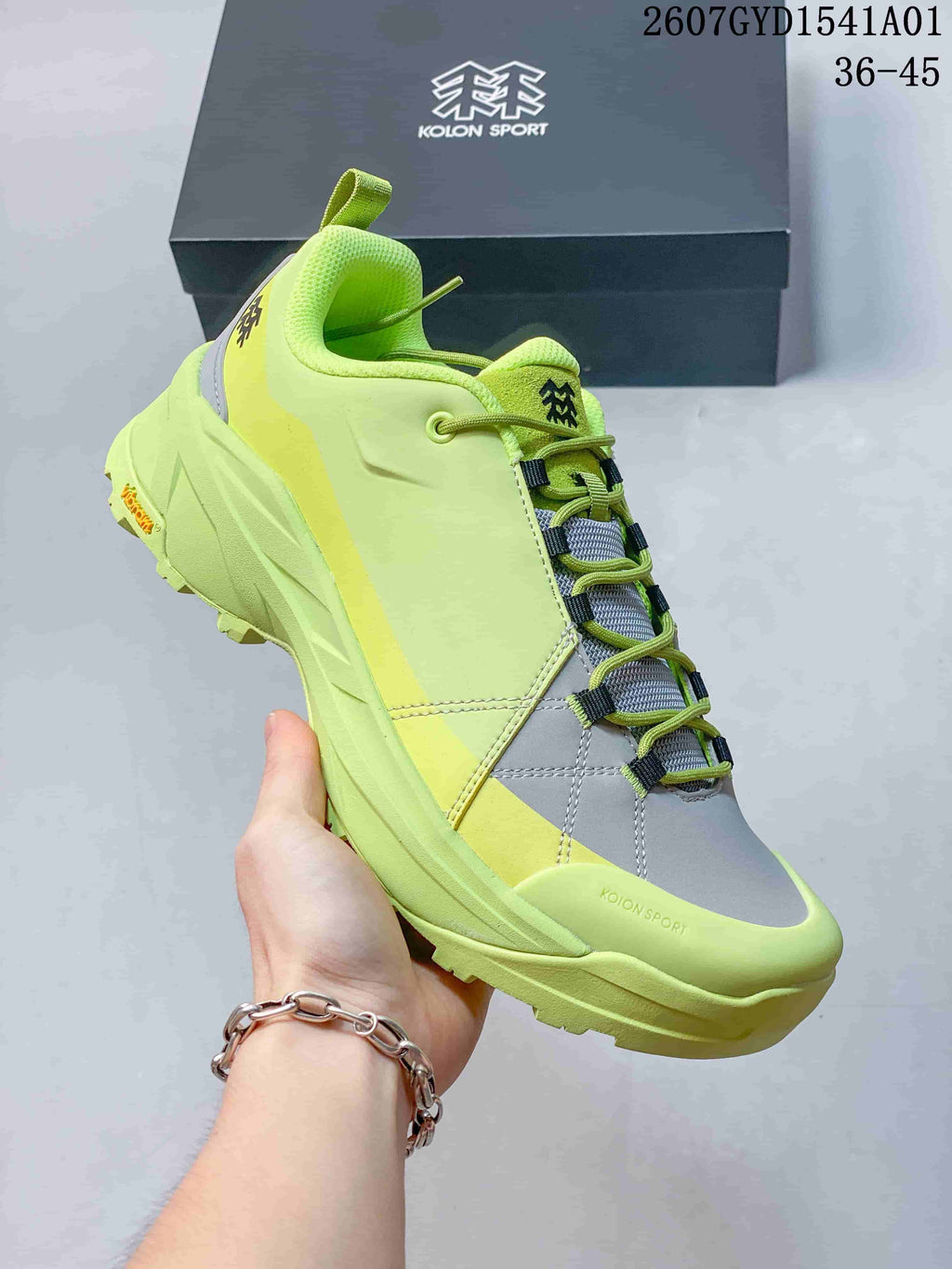 Close-up of the lime green sneaker showing its lacing and outsole