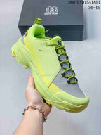 Close-up of the lime green sneaker showing its lacing and outsole
