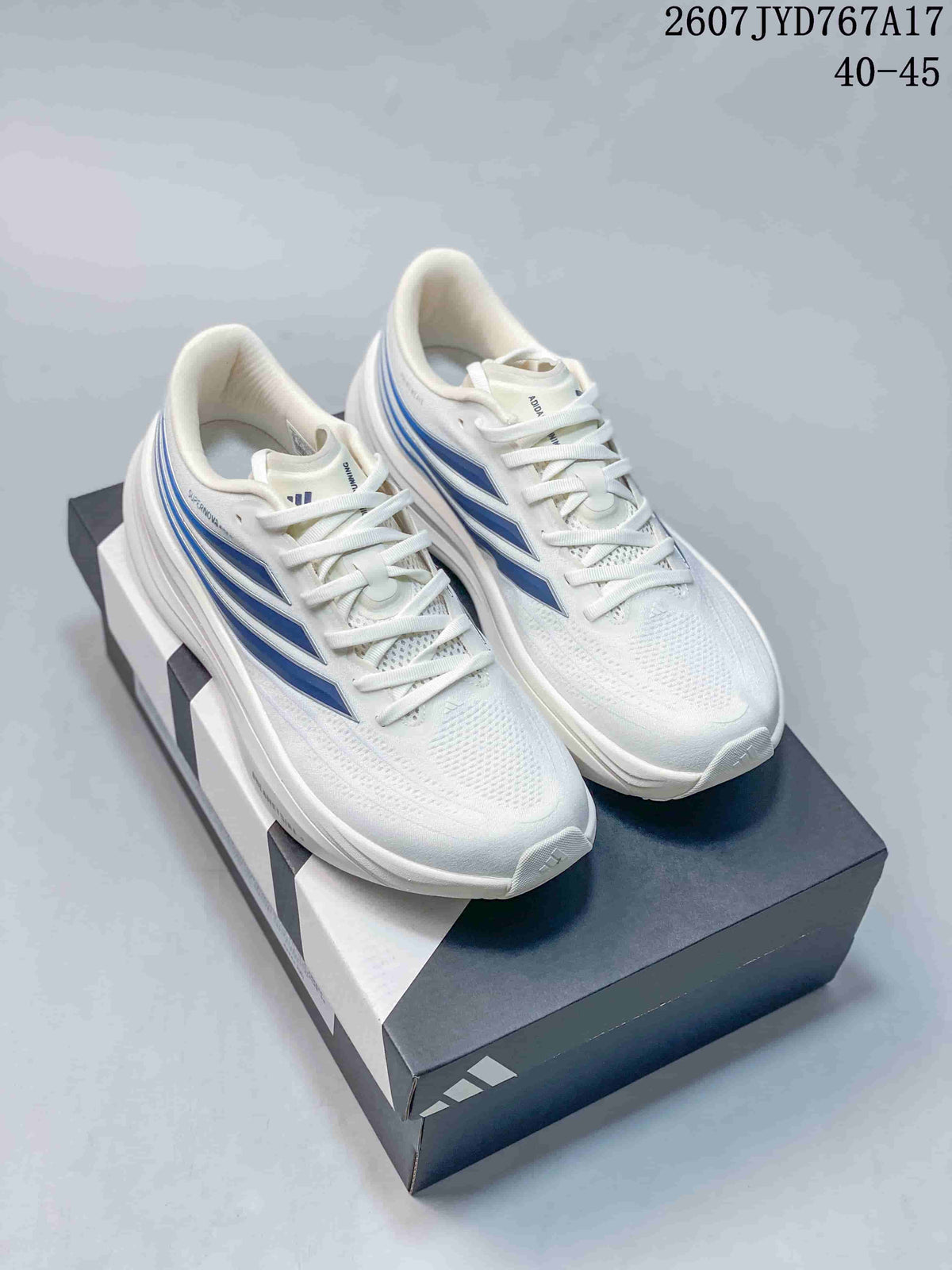 Pair of white Adidas sneakers with blue side accents and matching white laces.