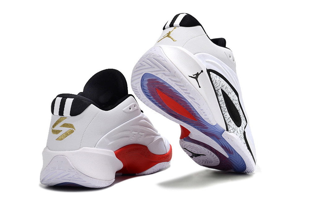 Rear and outsole views of white and black Jordan Luka 3 shoes with red accents