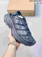 Close-up of a dark navy adidas Terrex shoe showing the side straps and lace fastening