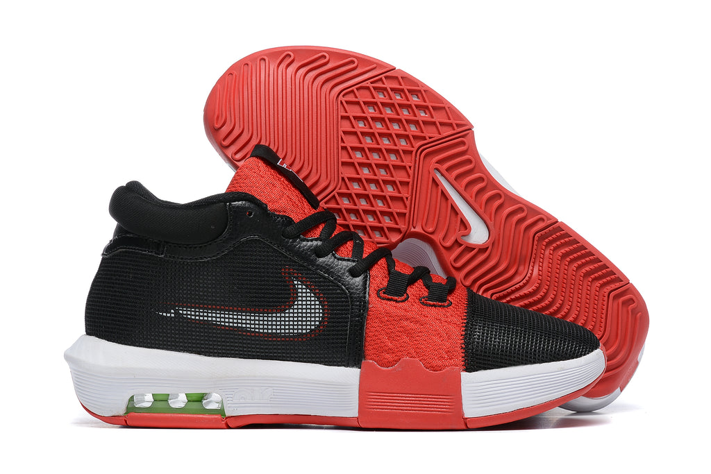 Black low-top basketball shoes with red and white accents, shown from the side and outsole.