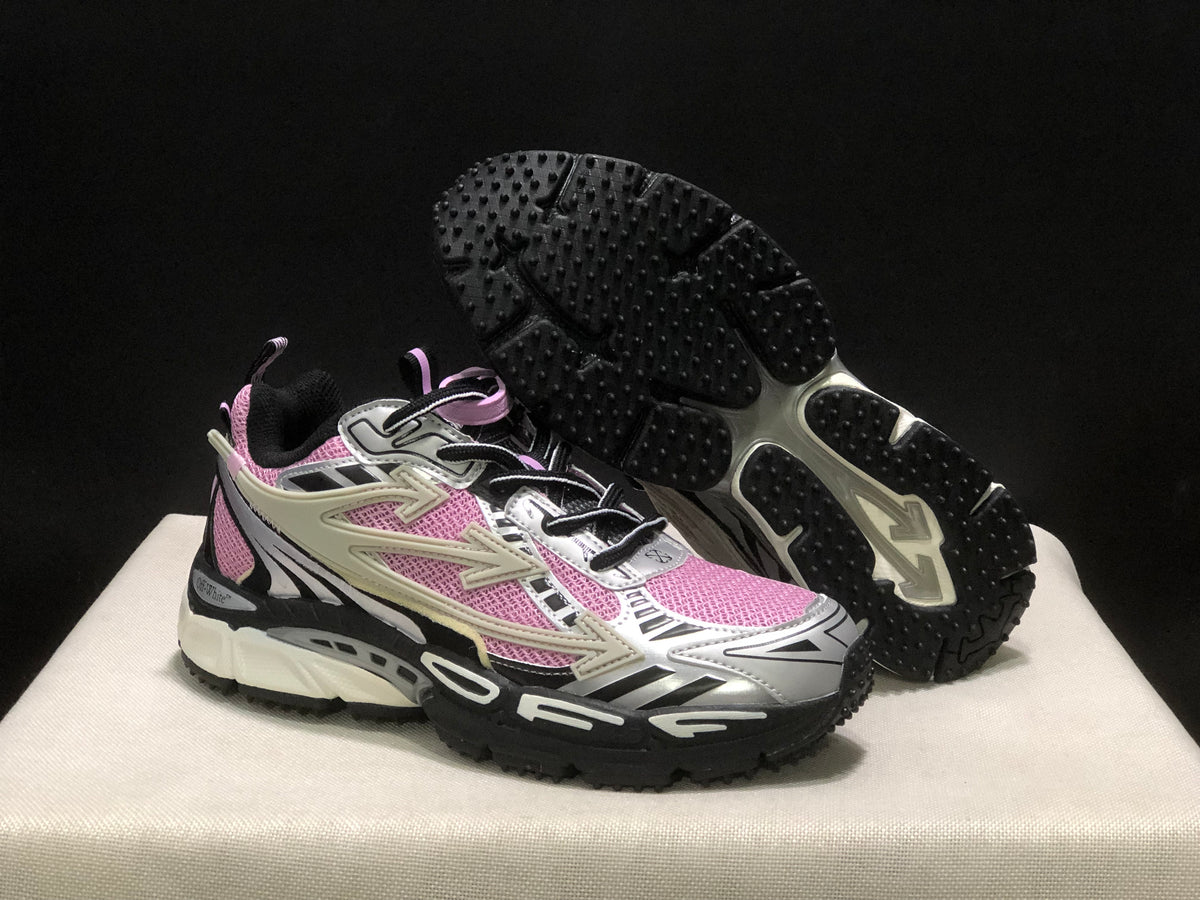 Pair shown with one shoe lifted to reveal the black textured outsole and segmented tread pattern.