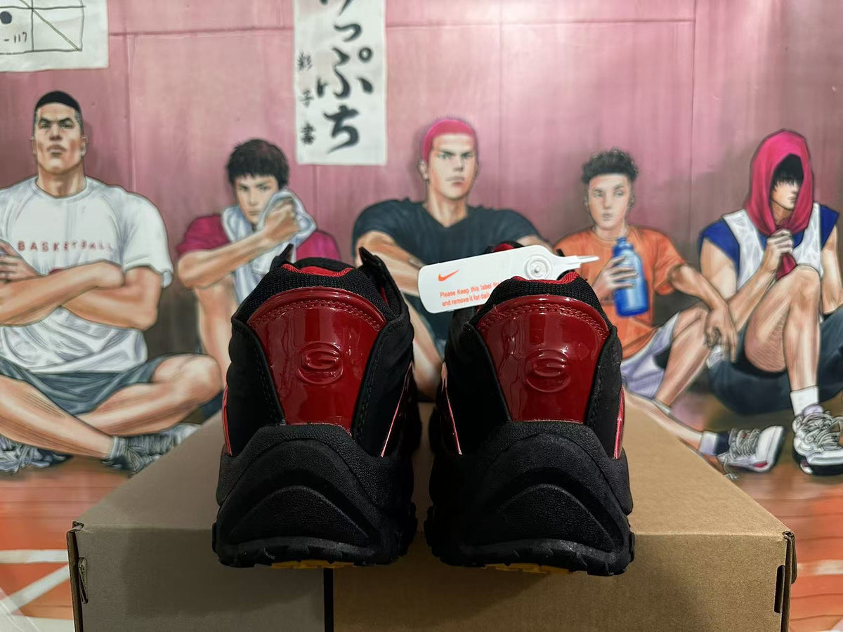 Rear view of black and red Nike Shox sneakers