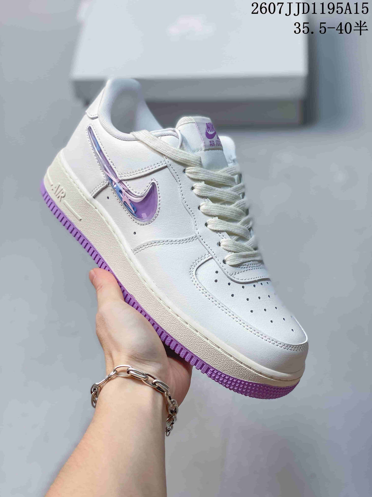 Close side view of a white Nike Air Force 1 sneaker with white laces, reflective-looking purple Swoosh detailing and a purple outsole.