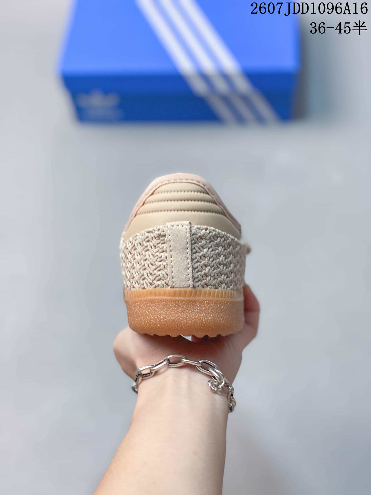 Rear view showing the woven-texture heel panels, cream detailing, and gum-colored outsole.
