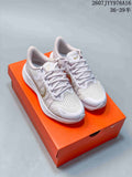 Pair of white and gold Nike Zoom Winflo 8 sneakers displayed on an orange shoe box.