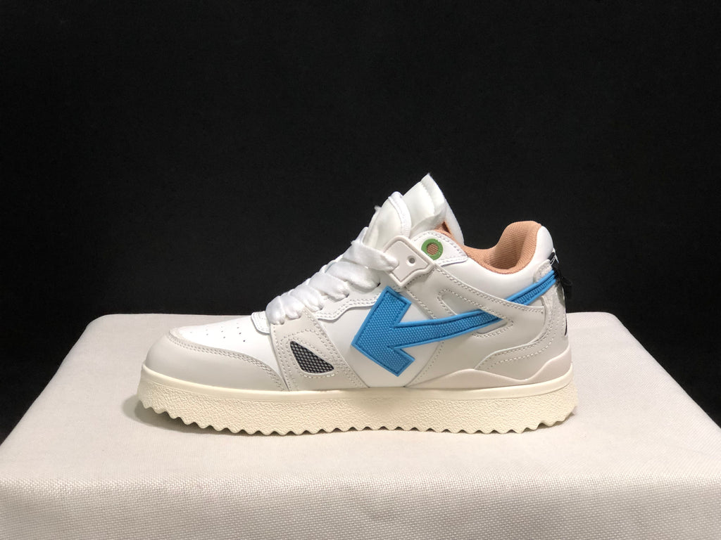 Lateral side profile showing the blue arrow detail, white upper, padded collar, and textured outsole.