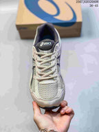 Front view of the gray ASICS Gel-Contend 4 sneaker showing the mesh toe box, laces, padded collar, and branded tongue.