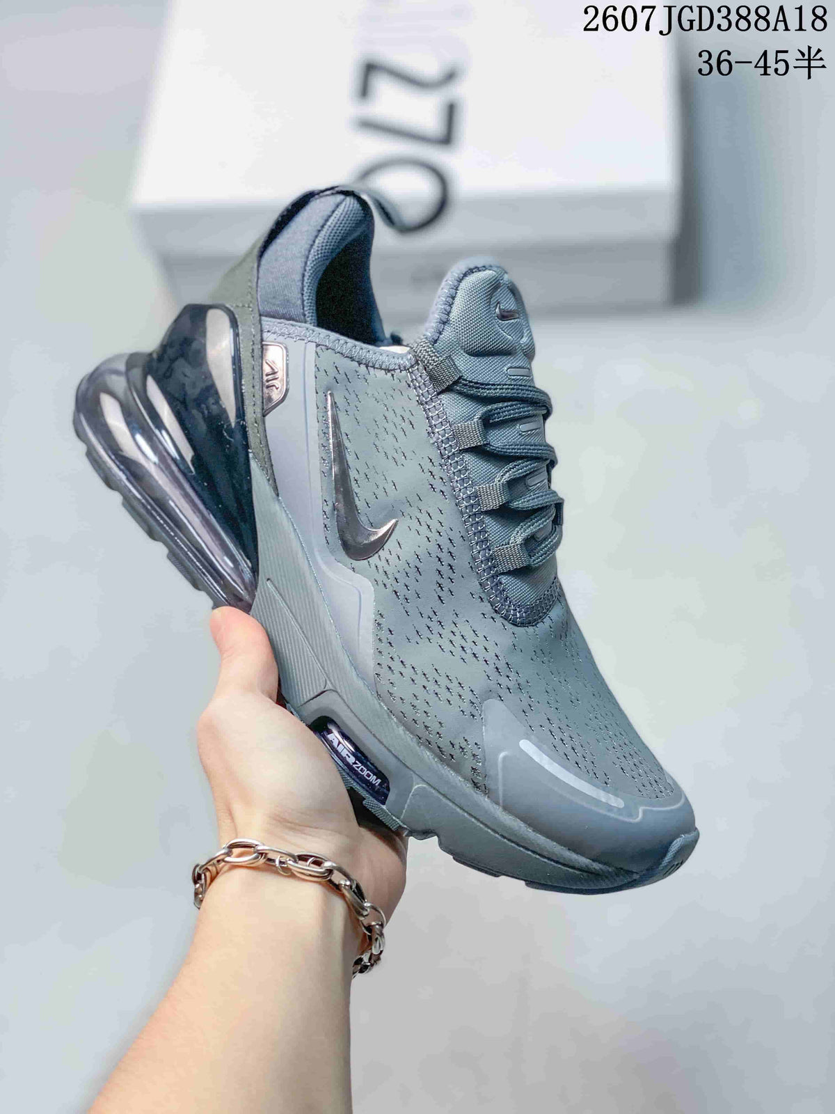 Gray Nike Air Max 270 Premium sneaker with dark accents and a translucent dark heel air unit.