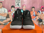 Front view of black Nike Hyperdunk high-top basketball shoes with white outsoles