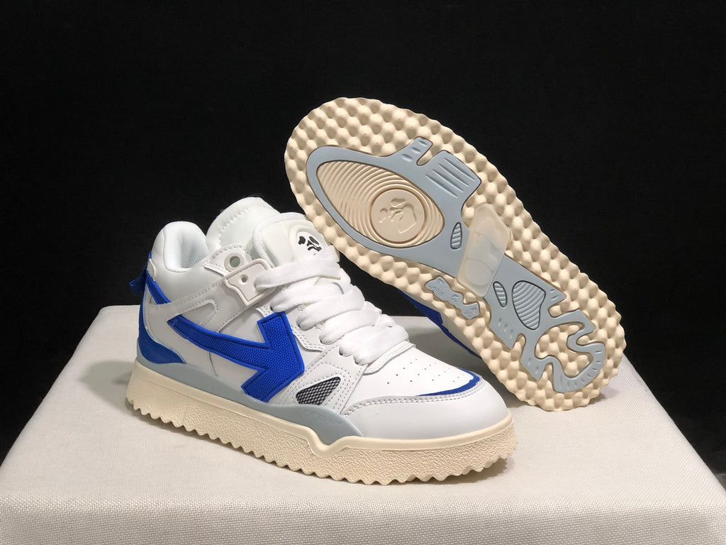 Angled product view with one sneaker lifted to reveal the cream and gray patterned outsole.