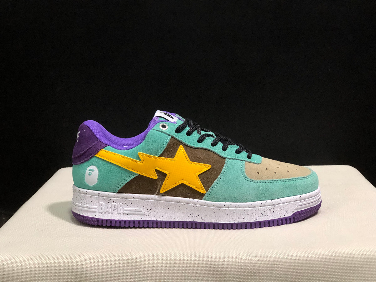 Side profile showing the Bape Sta low-top silhouette, mint green upper, yellow side detail, purple outsole, and embossed midsole branding.