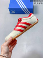 Side profile of the cream and red Tokyo MJ low-top sneaker.