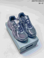 Pair of black and gray New Balance 740 sneakers displayed on a shoebox, with the source-listed code 2607NY248A18 and size range 36-47 visible above.