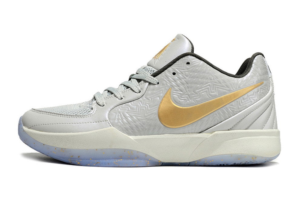 Side view of a gray and gold Ja 2 basketball shoe.