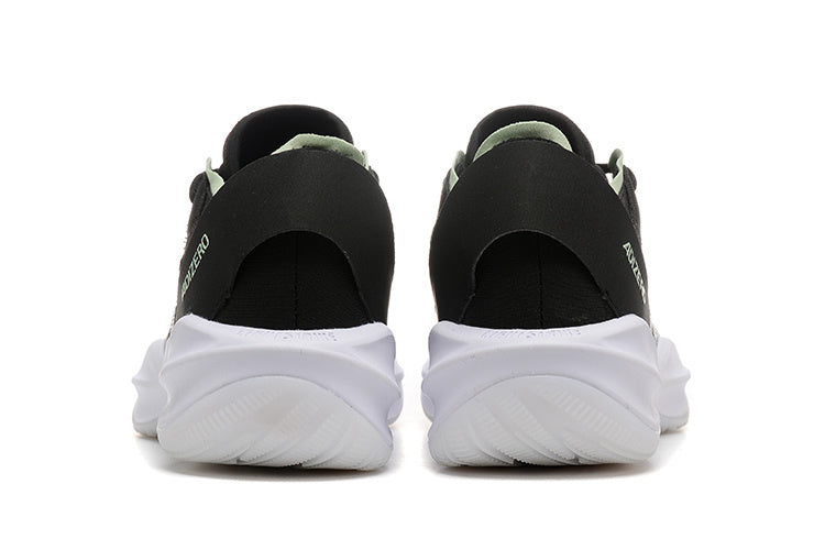 Rear view of black Adidas Adizero shoes with white soles