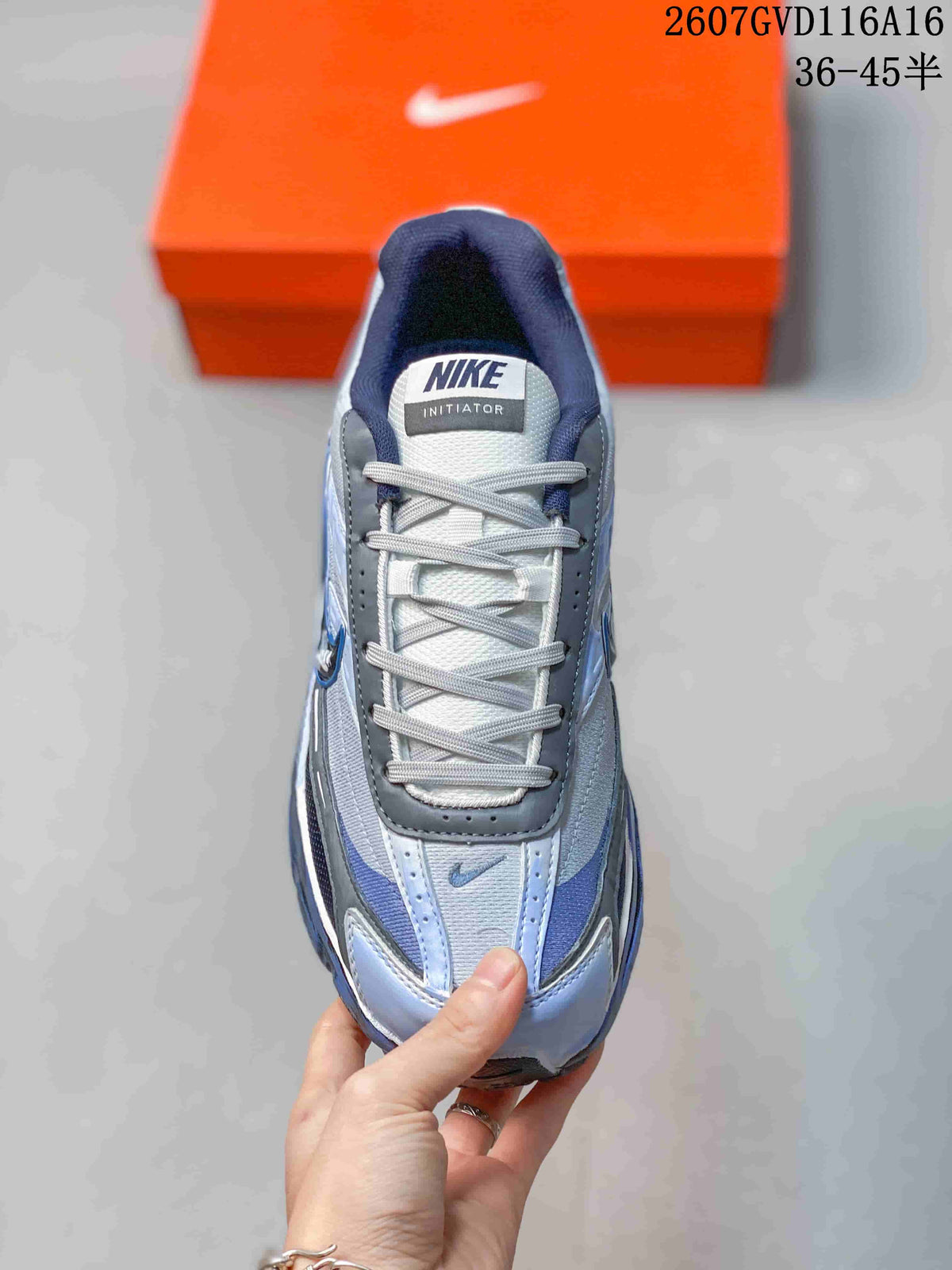 Top view showing the gray laces, padded tongue and Nike Initiator label.