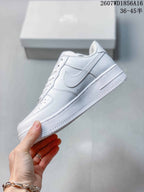 Side profile of the white low-top sneaker showing the Swoosh-style side detail, stitched panels, padded collar, and raised sole.