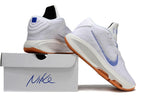 White and blue Nike GT Hustle 3 shoes displayed beside a shoe box.