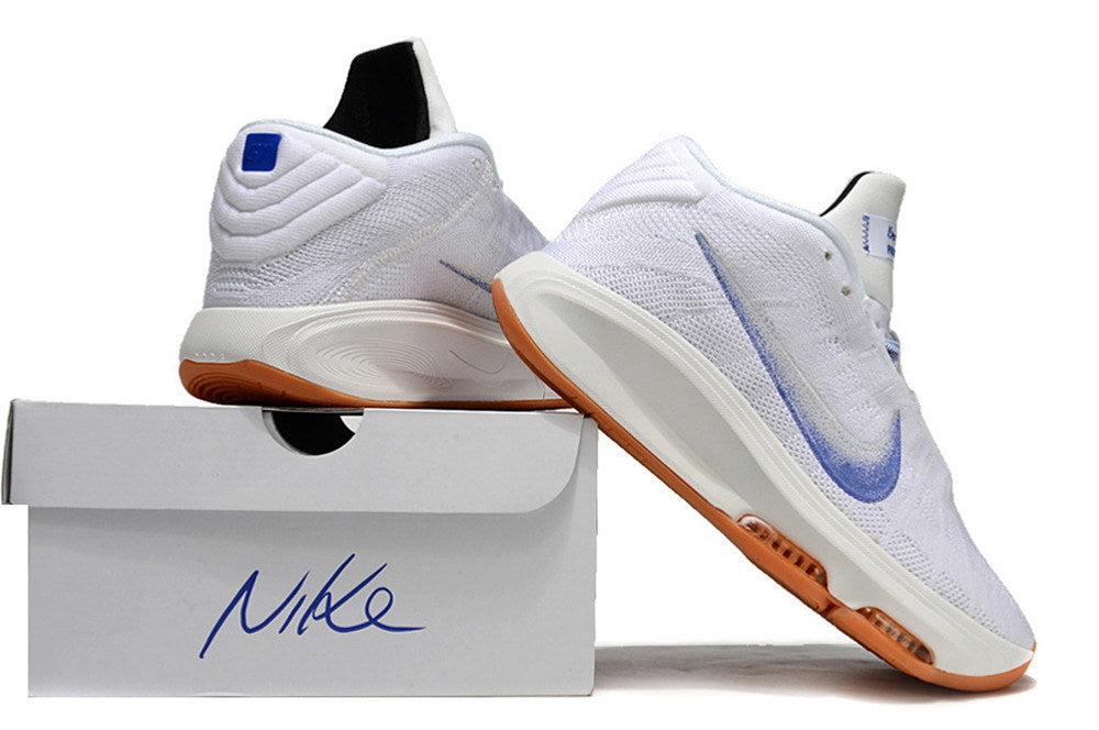 White and blue Nike GT Hustle 3 shoes displayed beside a shoe box.