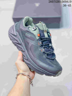 Close side view of a dark gray KAILAS shoe with green accents and a visible GO-TE-TEX marking on the upper.