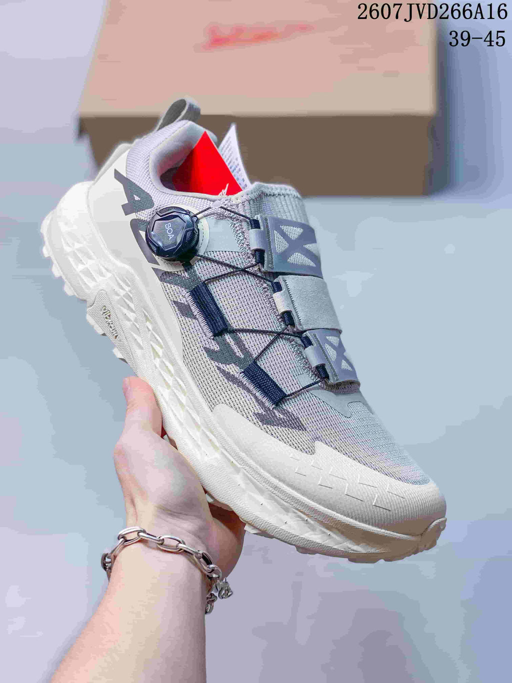 Light gray Altra TIMP 5 BOA trail running shoe shown from the side with a white sole, BOA dial, and contrasting upper details.