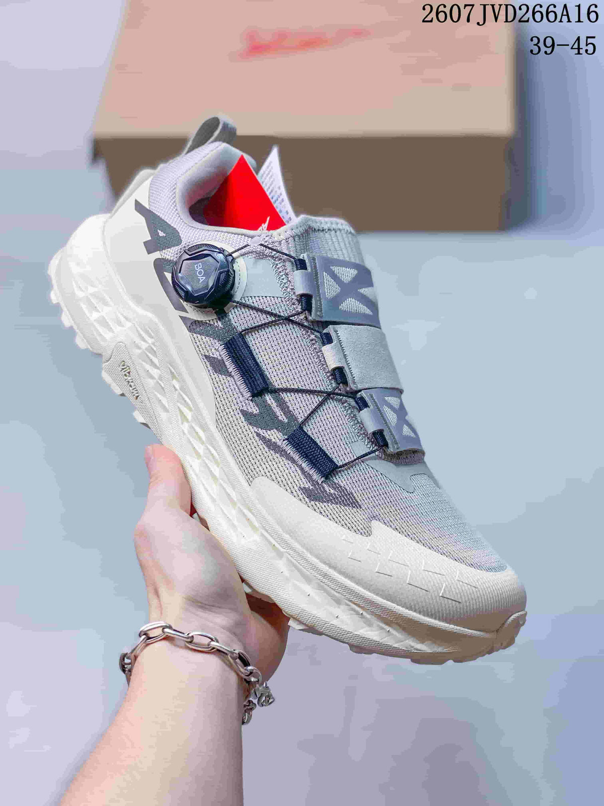 Light gray Altra TIMP 5 BOA trail running shoe shown from the side with a white sole, BOA dial, and contrasting upper details.