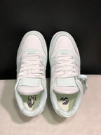 Top view of the pair showing flat white laces, perforated toe boxes, padded collars and graphic insole details.