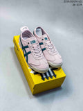 Pair of pink and teal Onitsuka Tiger sneakers displayed on a yellow shoebox, with style code 2510JGD291A22 and size range text visible at the top right.