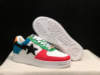 Angled view of the red, blue, green, and white sneaker with its patterned white outsole visible.