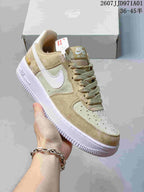 Close view of a tan and cream Nike Air Force 1 ’07 sneaker, showing the side Swoosh, laces and white sole; printed size range 36–45.