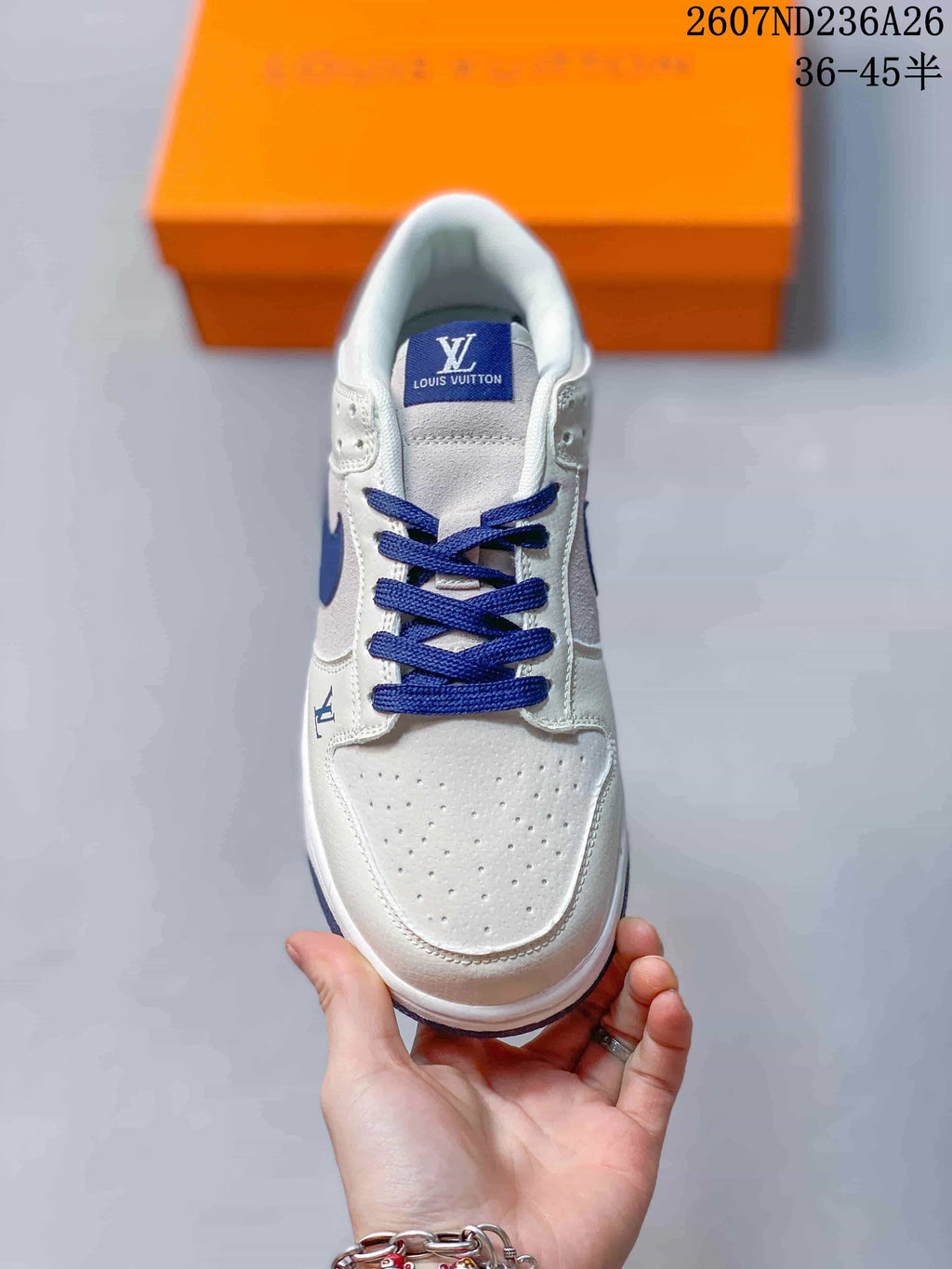 Top view showing the perforated white toe box, blue laces, and padded collar.