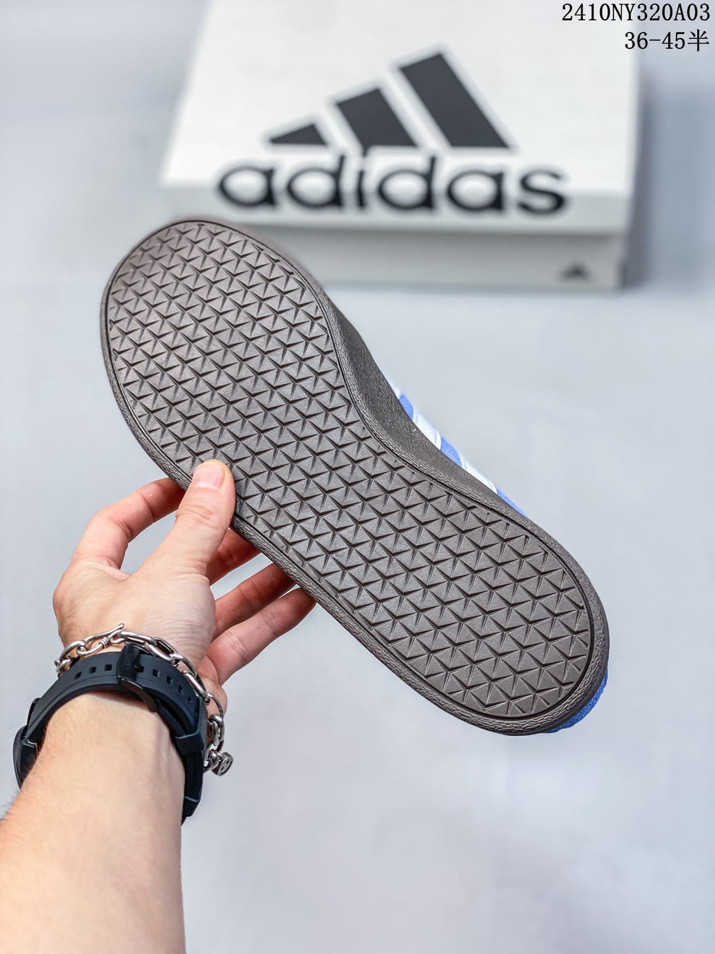Close view of the brown outsole showing its repeating geometric tread pattern.