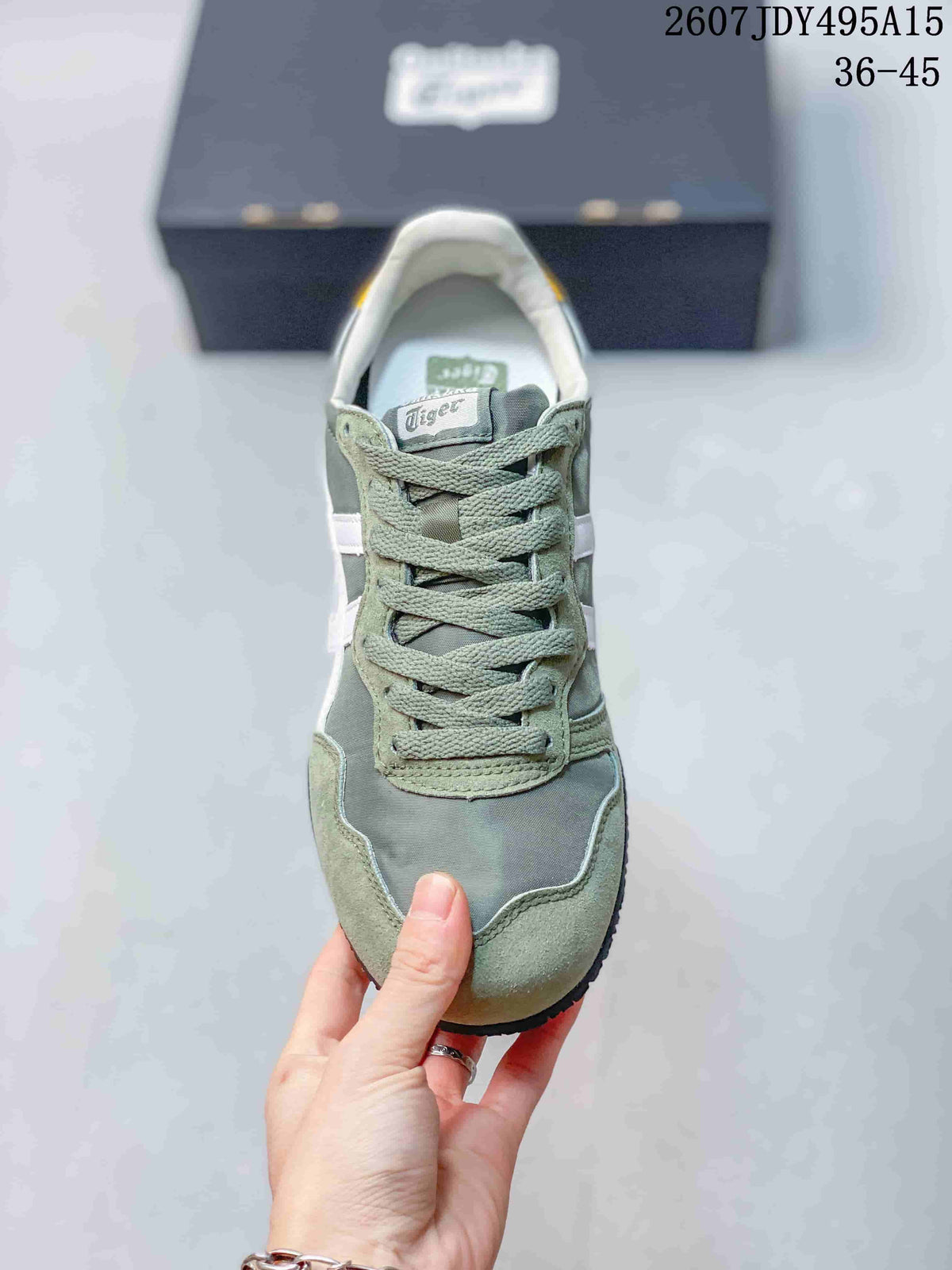 Top view of a green and white Onitsuka Tiger Serrano sneaker with matching laces, contrasting panels, and branded tongue.