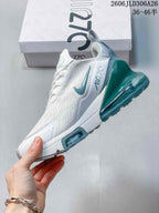 Side view of a white Nike Air Max 270 with teal accents and a prominent heel unit