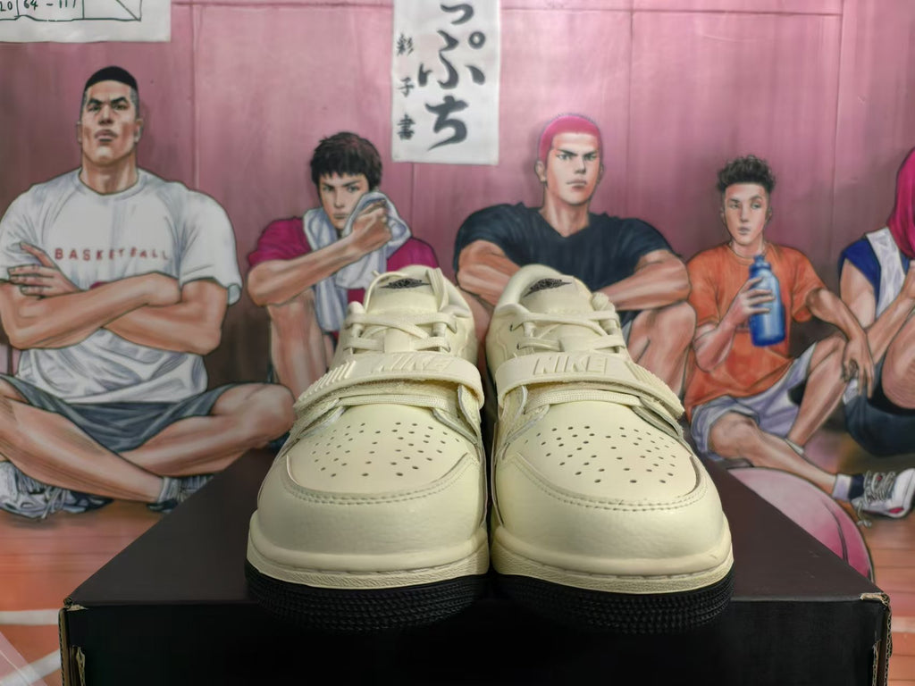 Front view of the sneakers showing perforated toes, laces, and midfoot straps