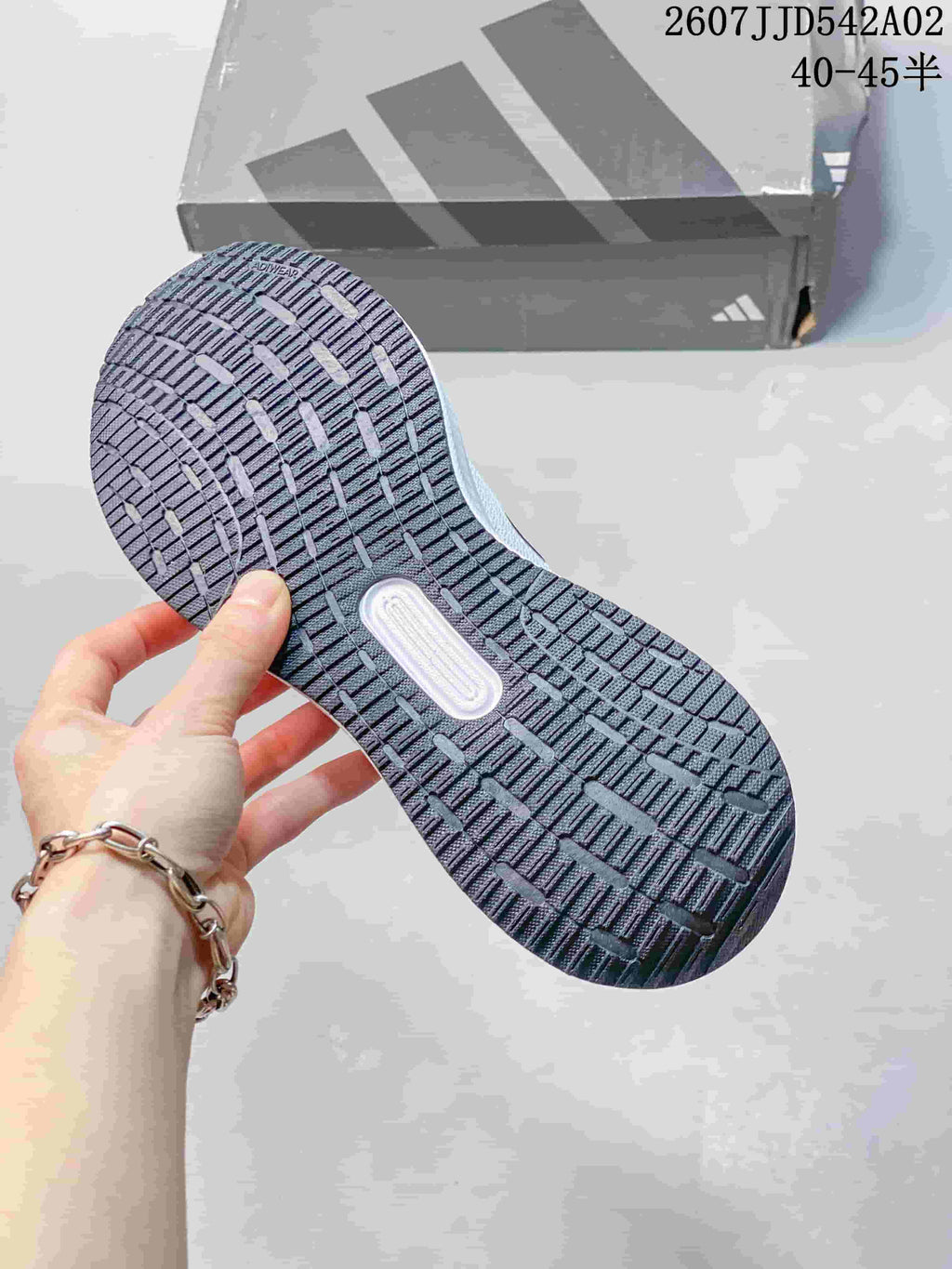 Close-up of the patterned outsole on the Adidas Runfalcon 5 shoe.