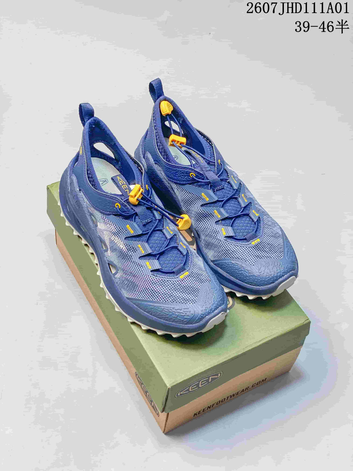 Blue KEEN Zionic ADV hiking shoes with yellow toggle laces on a shoe box