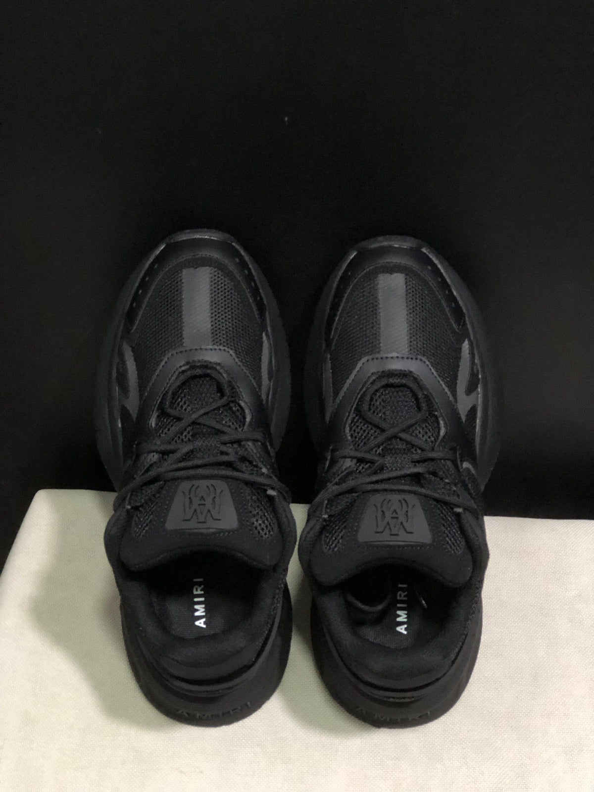 Top view showing the lace-up construction, padded tongues, and branded insoles.