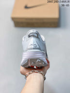 Rear view of the sneaker showing the padded heel collar, heel pull loop, and textured outsole.